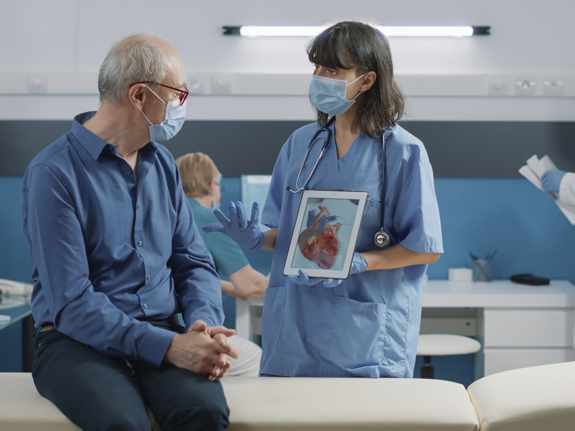 Clinician discussing whole-body health with a patient